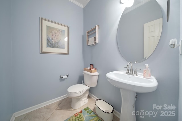 2017 White Cedar Ln, Waxhaw, NC 28173 - bathroom with ornamental molding, toilet, tile patterned flooring, and baseboards