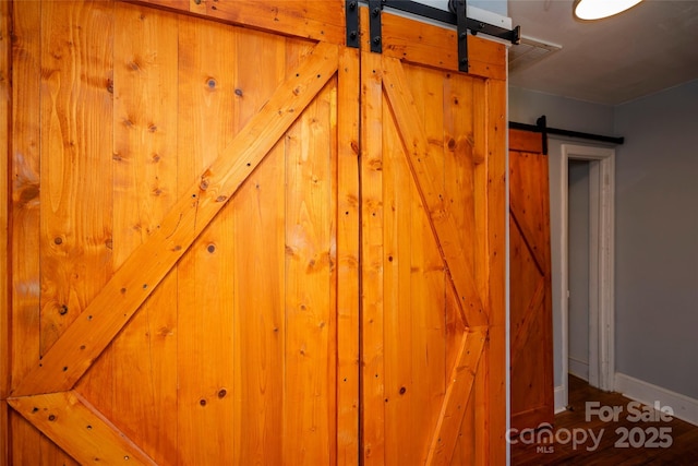 detailed view of a barn door and baseboards