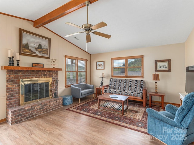 336 Stoney Ridge Loop, Maggie Valley, NC 28751 - living room with wood finished floors, a ceiling fan, and a brick fireplace