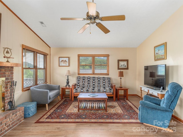 336 Stoney Ridge Loop, Maggie Valley, NC 28751 - living area featuring healthy amount of natural light, wood finished floors, vaulted ceiling, ceiling fan, and ornamental molding