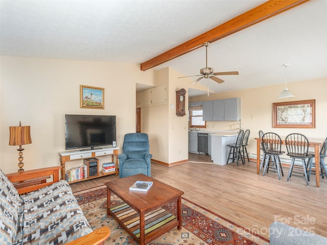 336 Stoney Ridge Loop, Maggie Valley, NC 28751 - living area featuring light wood-style flooring, a ceiling fan, and baseboards