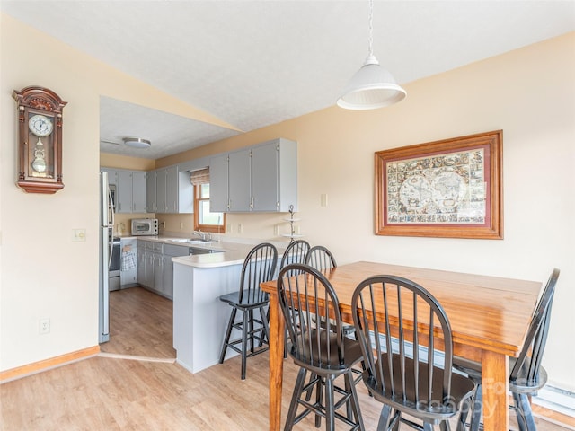 336 Stoney Ridge Loop, Maggie Valley, NC 28751 - dining room with light wood finished floors and baseboards