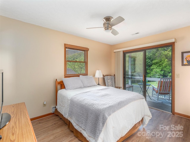 336 Stoney Ridge Loop, Maggie Valley, NC 28751 - bedroom featuring access to outside, light wood-type flooring, baseboards, and ceiling fan