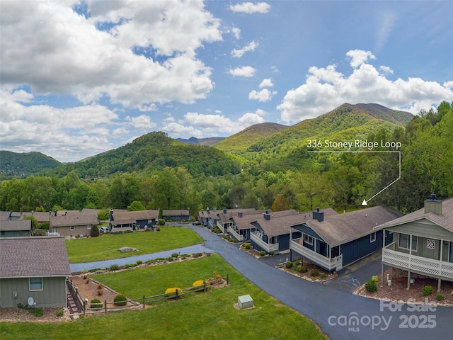336 Stoney Ridge Loop, Maggie Valley, NC 28751 - view of mountain backdrop featuring a forest and nearby suburban area