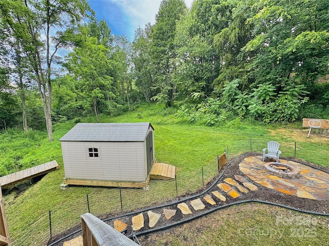 153 Arrowood Corner Rd, Mars Hill, NC 28754 - view of green lawn with an outdoor fire pit and a shed