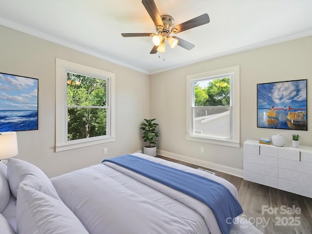 83 Woodsdale Pl SE, Concord, NC 28025 - bedroom with wood finished floors, baseboards, crown molding, and a ceiling fan