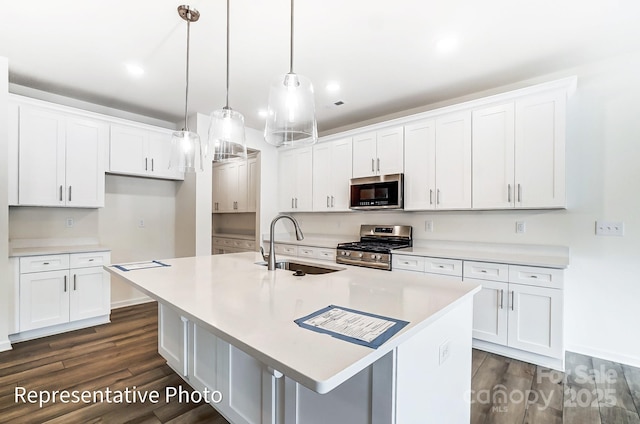 8619 Frank Grier Rd Unit 3, Charlotte, NC 28215 - kitchen with stainless steel appliances, a sink, dark wood finished floors, and white cabinets