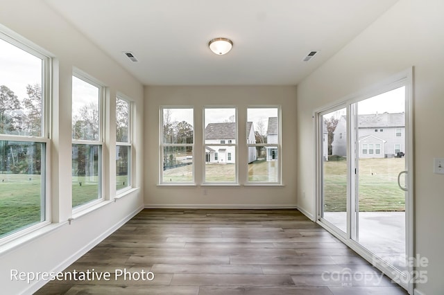 8619 Frank Grier Rd Unit 3, Charlotte, NC 28215 - unfurnished sunroom with healthy amount of natural light, wood finished floors, and baseboards