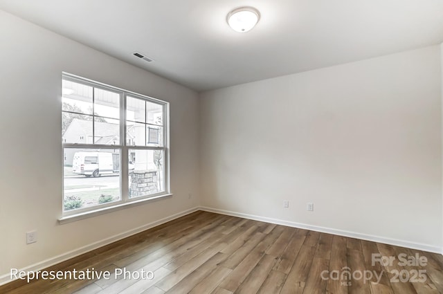 8619 Frank Grier Rd Unit 3, Charlotte, NC 28215 - unfurnished room with wood finished floors and baseboards
