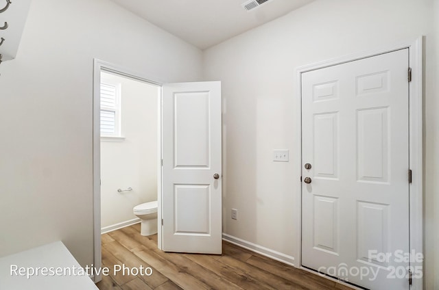 8619 Frank Grier Rd Unit 3, Charlotte, NC 28215 - bathroom with wood finished floors, toilet, and baseboards