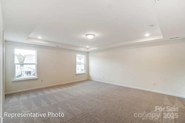 8619 Frank Grier Rd Unit 3, Charlotte, NC 28215 - empty room featuring a tray ceiling, baseboards, carpet flooring, and recessed lighting