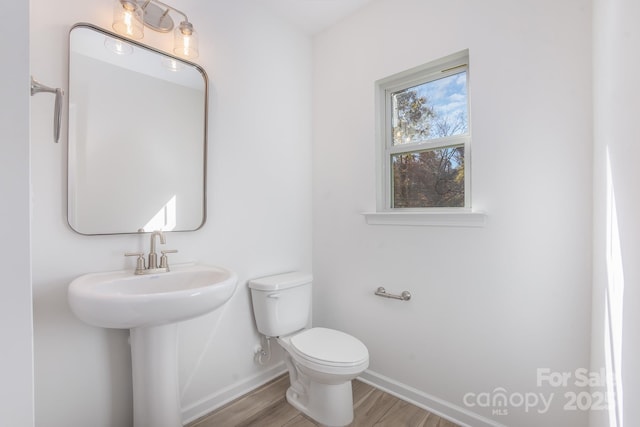 318 Sixth St, Belmont, NC 28012 - half bathroom with baseboards, toilet, and wood finished floors