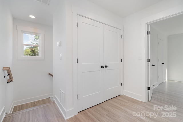 318 Sixth St, Belmont, NC 28012 - hallway featuring light wood finished floors, baseboards, and an upstairs landing