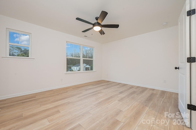 318 Sixth St, Belmont, NC 28012 - spare room featuring light wood-style flooring, a ceiling fan, and baseboards