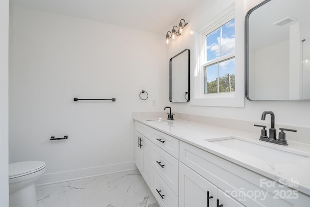 318 Sixth St, Belmont, NC 28012 - full bathroom with baseboards, marble finish floors, double vanity, and toilet