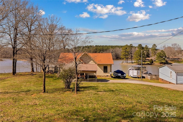 3062 Bass Dr, Sherrills Ford, NC 28673 - view of front of property with driveway, a front yard, metal roof, a detached carport, and a water view