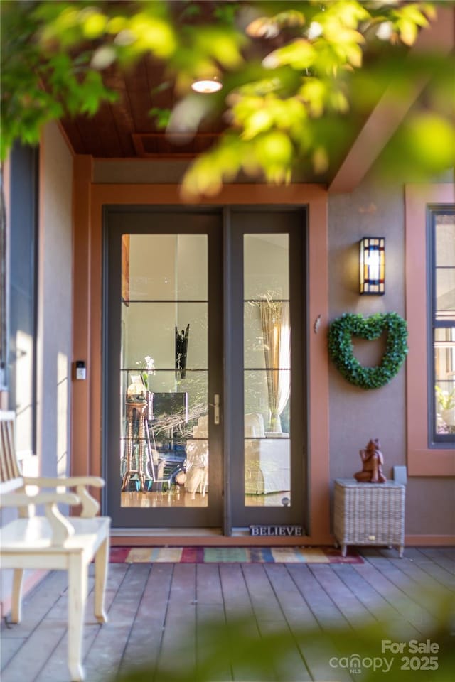 doorway to property with stucco siding