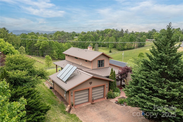view from above of property with a forest