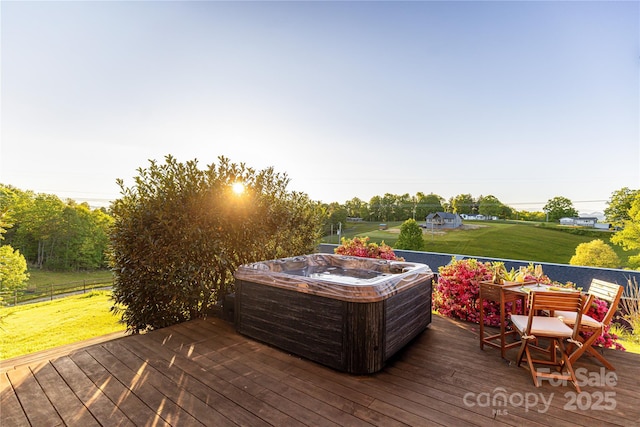wooden deck with a hot tub and outdoor dining space