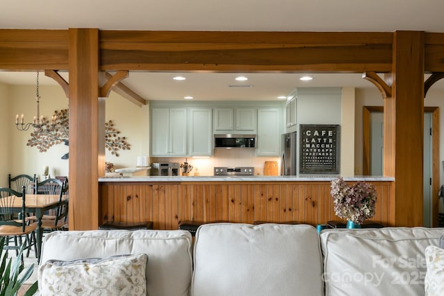 61 Creekside Way Unit G/101, Burnsville, NC 28714 - kitchen featuring stainless steel appliances, open floor plan, a chandelier, recessed lighting, and light countertops