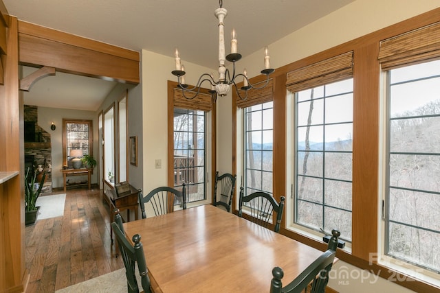 61 Creekside Way Unit G/101, Burnsville, NC 28714 - dining room with a chandelier, wood-type flooring, and plenty of natural light