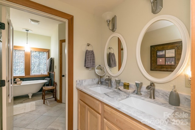 61 Creekside Way Unit G/101, Burnsville, NC 28714 - bathroom with double vanity, tile patterned flooring, and a freestanding bath