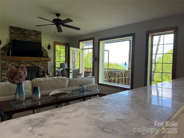 61 Creekside Way Unit G/101, Burnsville, NC 28714 - living area featuring ceiling fan and a fireplace