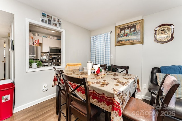 330 Culp St, Mooresville, NC 28115 - dining space featuring wood finished floors and baseboards