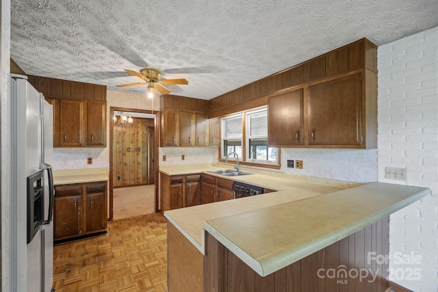 1 Ola Dr, Candler, NC 28715 - kitchen with white fridge with ice dispenser, a sink, a peninsula, ceiling fan, and light countertops
