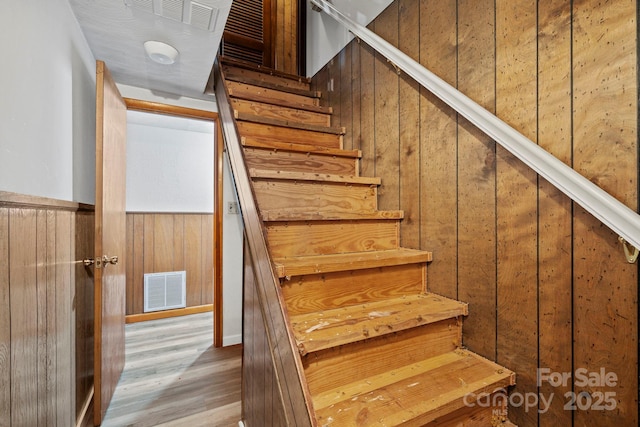 1 Ola Dr, Candler, NC 28715 - staircase with wood walls and wood finished floors