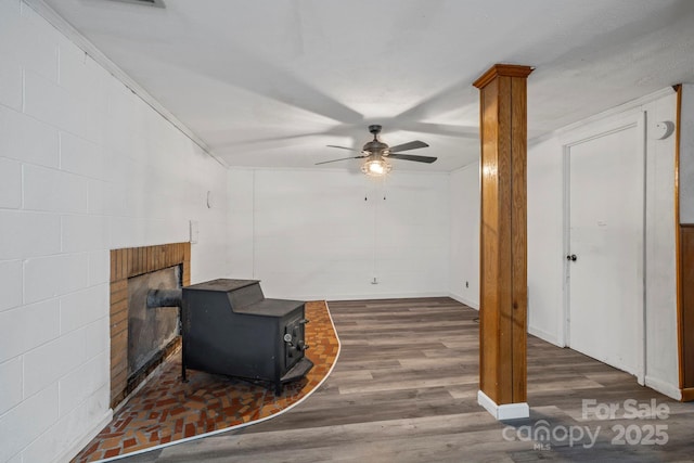 1 Ola Dr, Candler, NC 28715 - living room with wood finished floors, ceiling fan, a brick fireplace, and a wood stove