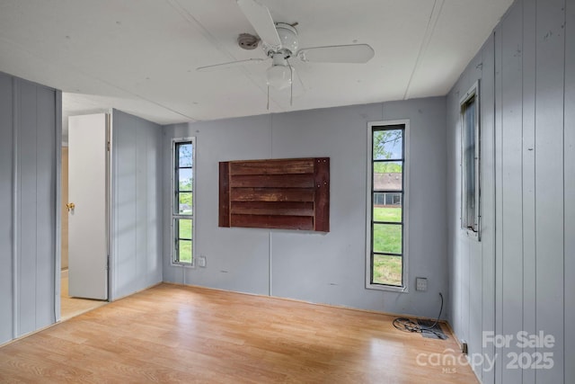 1 Ola Dr, Candler, NC 28715 - spare room with wood finished floors, healthy amount of natural light, and ceiling fan