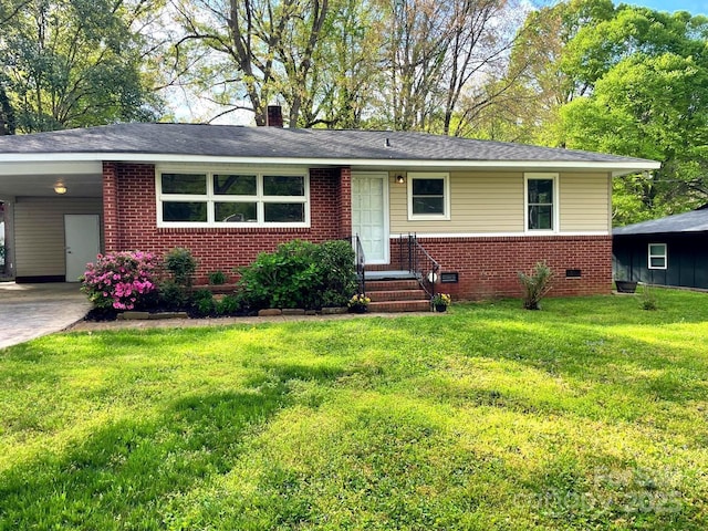 509 N St, Belmont, NC 28012 - view of front of property featuring brick siding, a front yard, a carport, and concrete driveway