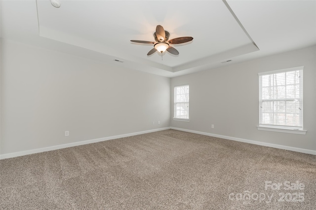 10008 King George Ln, Waxhaw, NC 28173 - carpeted empty room featuring a raised ceiling, ceiling fan, and baseboards