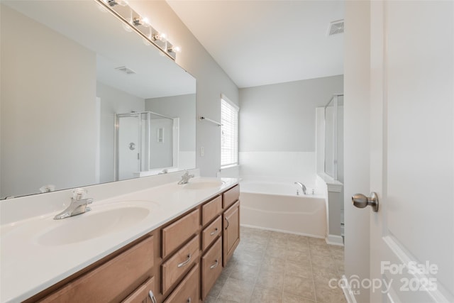 10008 King George Ln, Waxhaw, NC 28173 - bathroom featuring a bath, a shower stall, double vanity, and tile patterned flooring