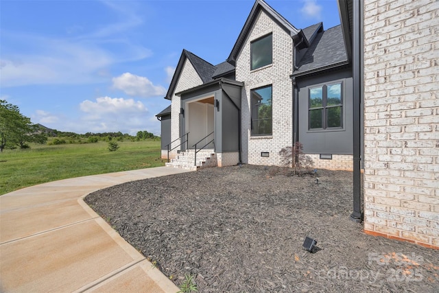 1141 Harper Lee Dr, Newton, NC 28658 - view of property exterior featuring crawl space, brick siding, and roof with shingles