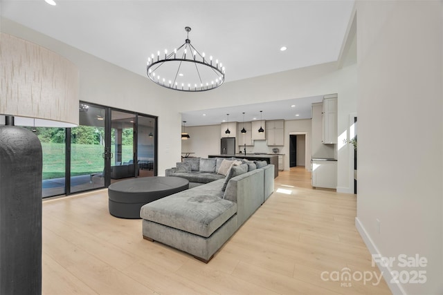 1141 Harper Lee Dr, Newton, NC 28658 - living room with light wood-style floors, recessed lighting, and a chandelier