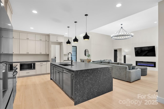 1141 Harper Lee Dr, Newton, NC 28658 - kitchen featuring built in microwave, light wood-style flooring, a chandelier, recessed lighting, and decorative light fixtures