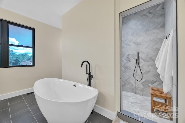 1141 Harper Lee Dr, Newton, NC 28658 - bathroom with a freestanding bath, walk in shower, and tile patterned floors