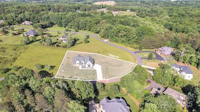 1141 Harper Lee Dr, Newton, NC 28658 - aerial view of property and surrounding area featuring property parcel outlined and a heavily wooded area