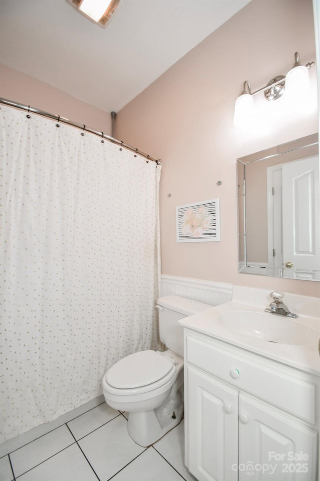 7328 S Providence Rd, Waxhaw, NC 28173 - bathroom featuring tile patterned floors, a wainscoted wall, vanity, and toilet