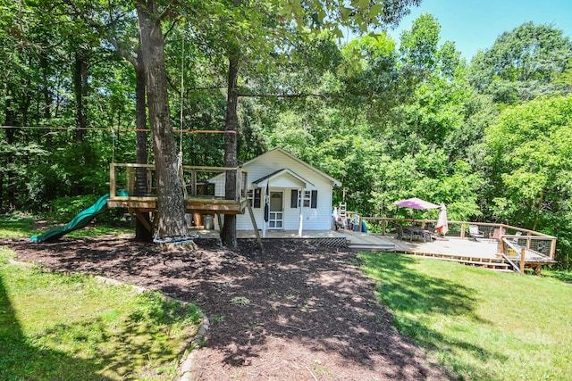 7328 S Providence Rd, Waxhaw, NC 28173 - rear view of house with a yard, a wooden deck, a playground, and a view of trees