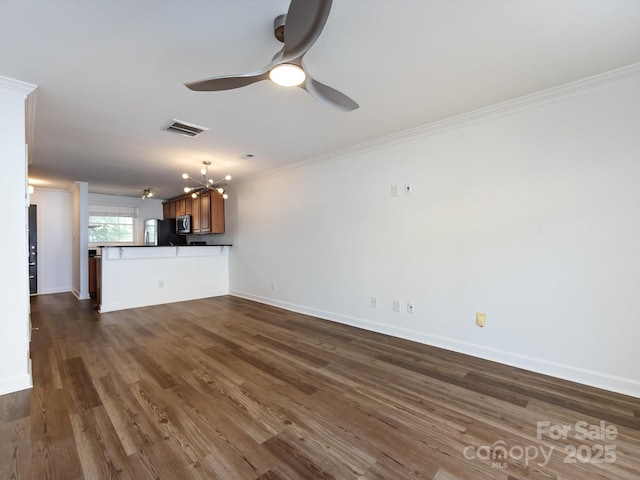 unfurnished living room featuring ornamental molding, a chandelier, ceiling fan, dark wood-style flooring, and baseboards