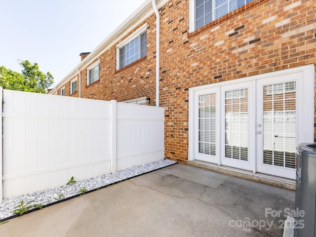 view of patio featuring fence