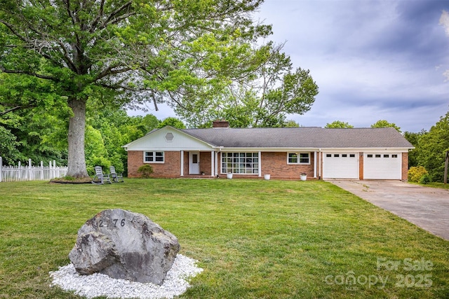 single story home with a garage, a chimney, brick siding, and concrete driveway