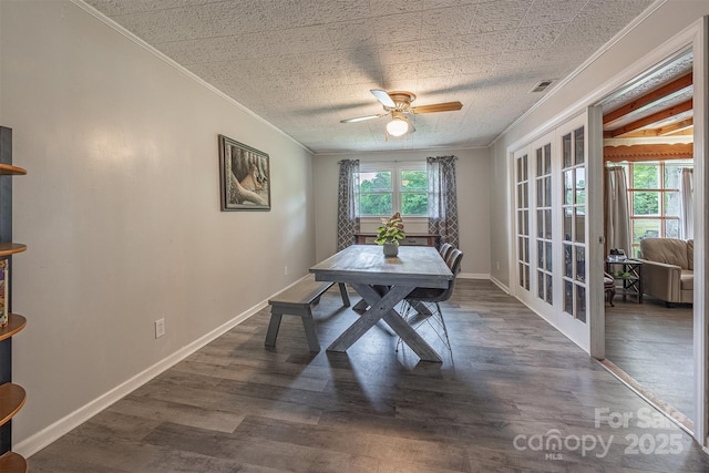 dining space with ornamental molding, french doors, a ceiling fan, wood finished floors, and baseboards