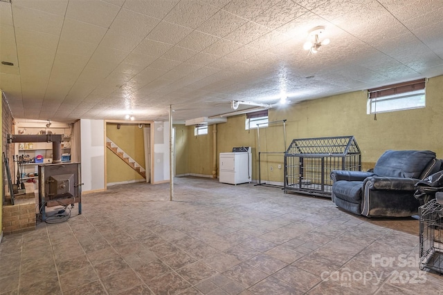 below grade area with washer / clothes dryer and stairway