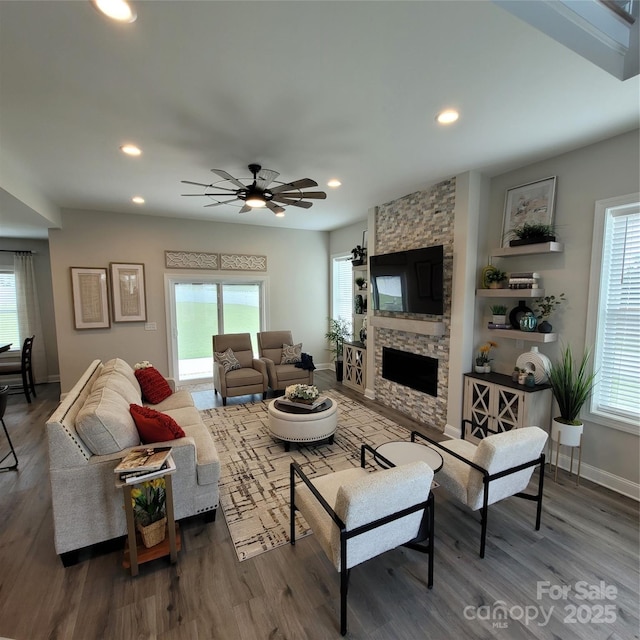 5118 Regents Park Dr, Hickory, NC 28602 - living room with wood finished floors, plenty of natural light, a stone fireplace, and recessed lighting