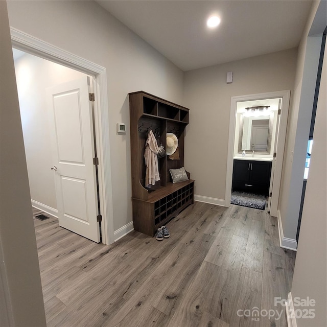 5118 Regents Park Dr, Hickory, NC 28602 - mudroom featuring light wood finished floors and baseboards
