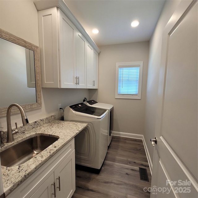 5118 Regents Park Dr, Hickory, NC 28602 - washroom with washing machine and clothes dryer, cabinet space, baseboards, dark wood finished floors, and recessed lighting